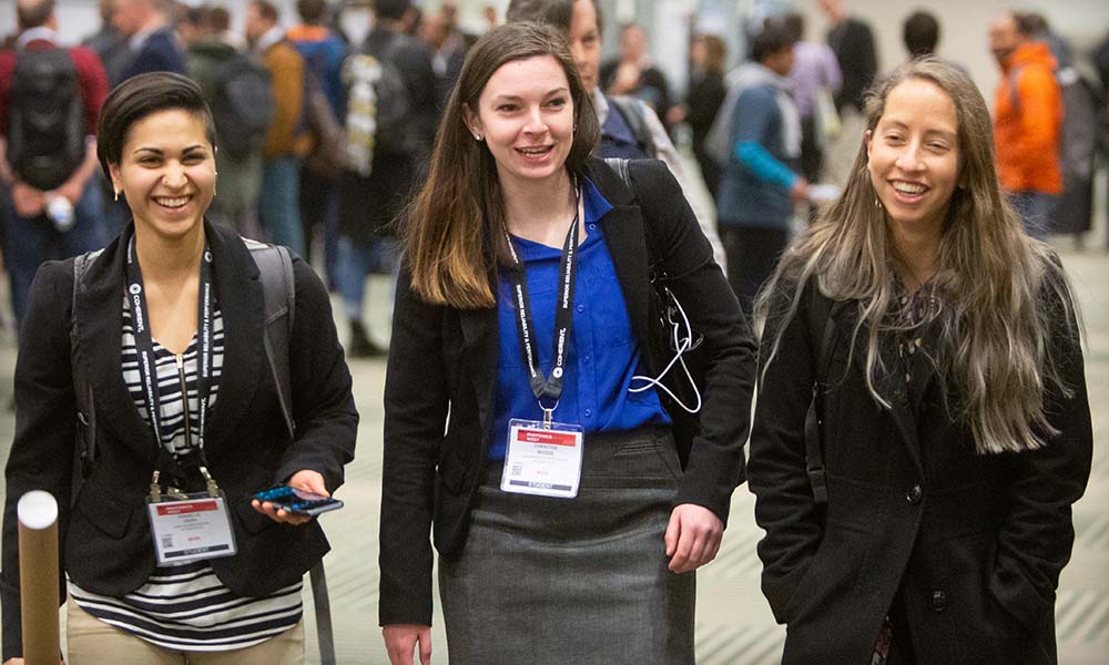 Three attendees at an SPIE conference