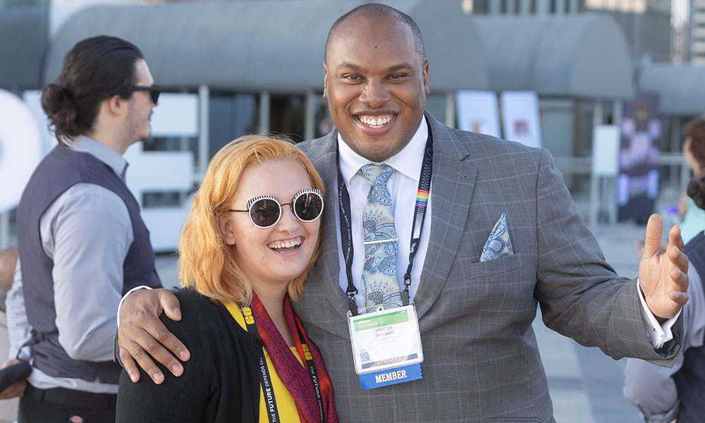 A man and a woman socializing at an SPIE inclusive event.