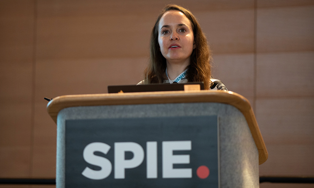 Female speaker at podium of SPIE Photomask Technology + EUVL