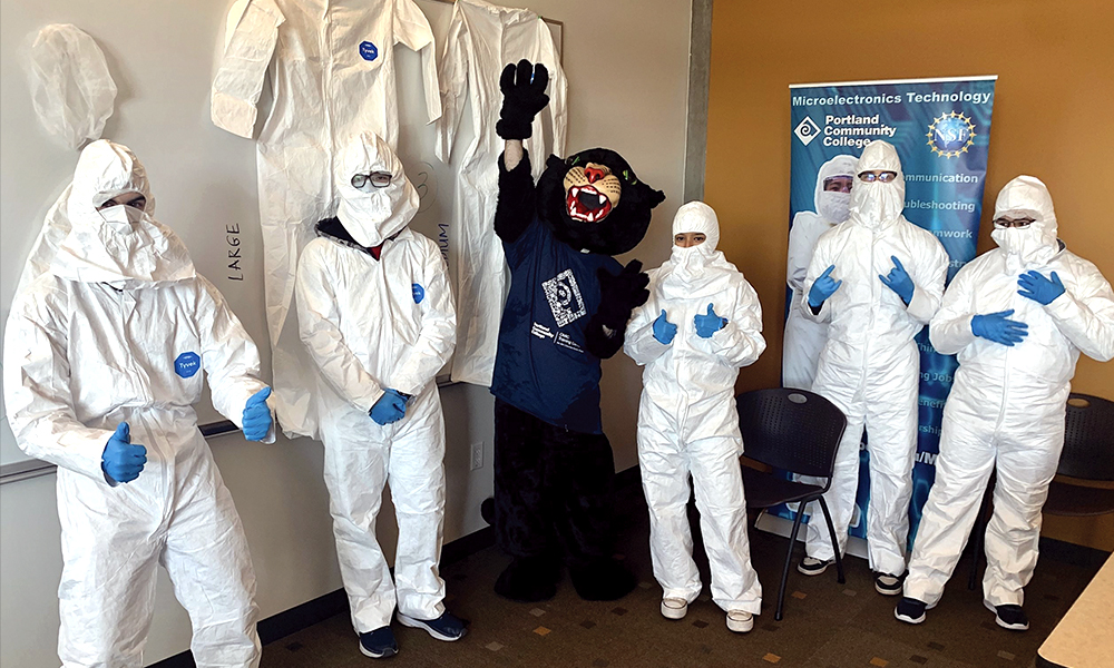 2024 Catalyst Award winners from Intel Corporation at their workplace in "bunny suits"  