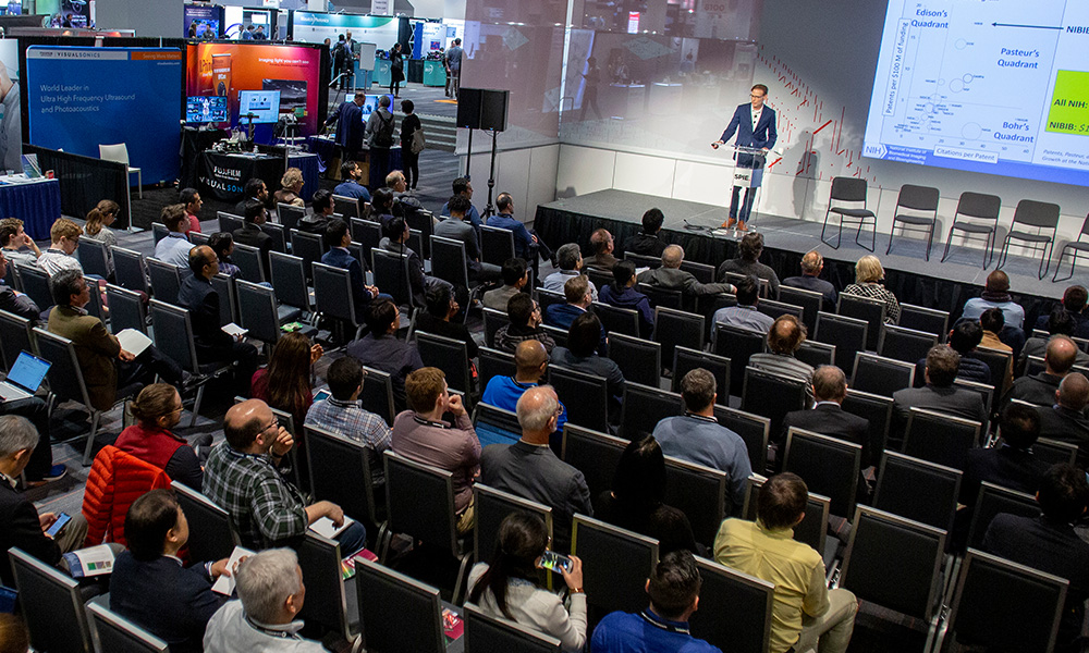 Speaker and audience at SPIE Photonex