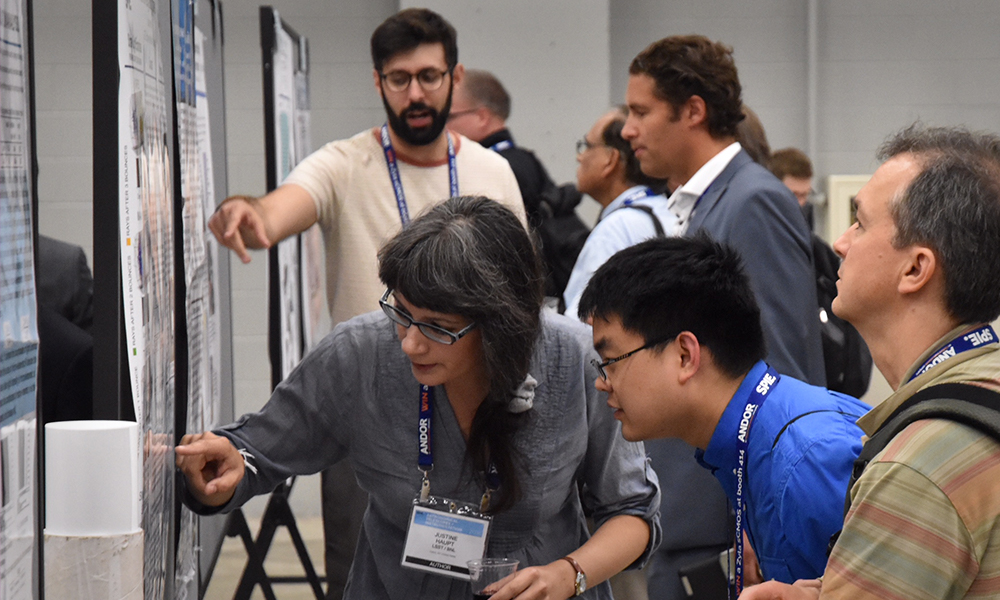 Attendees at a poster session at SPIE Astronomical Telescopes + Instrumentation