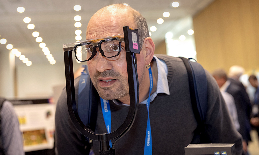 An attendee tries a product at the exhibition