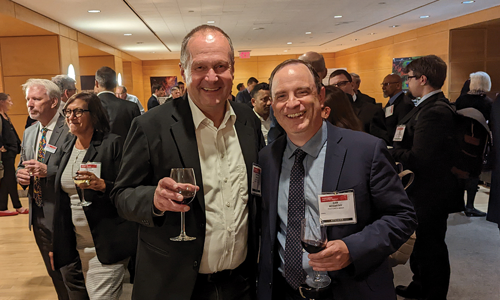 Two gentlemen network at SPIE Photonics Industry Summit and discuss the future of the optics and photonics industry