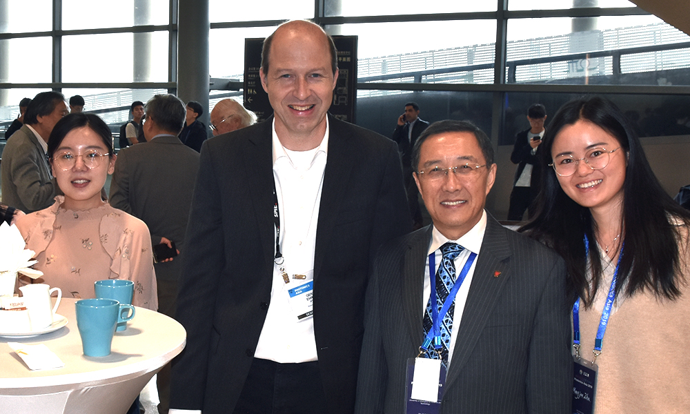 Attendees enjoying a networking event at SPIE/COS Photonics Asia