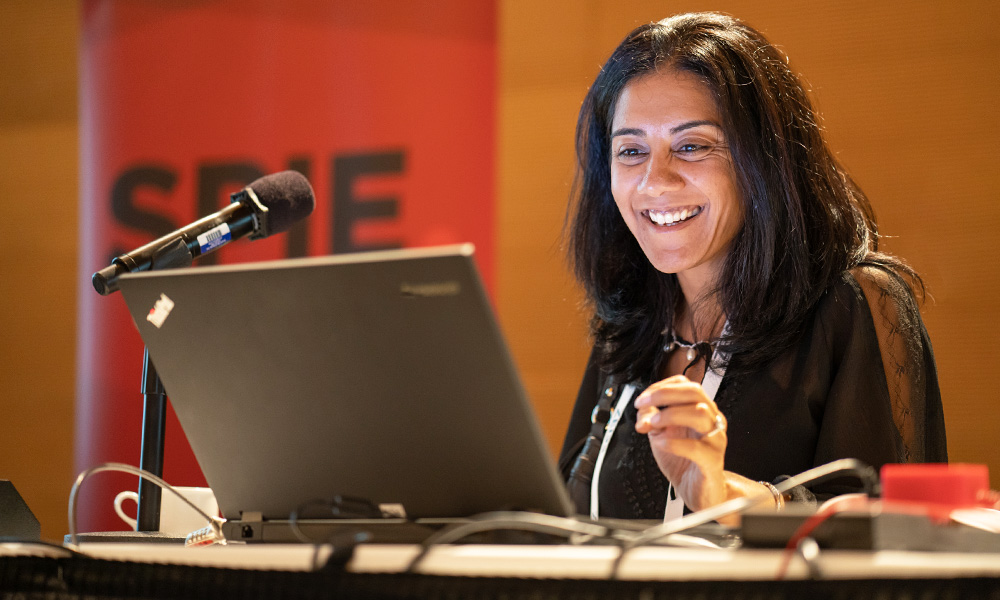 A speaker gets ready to begin her oral presentation at an SPIE conference