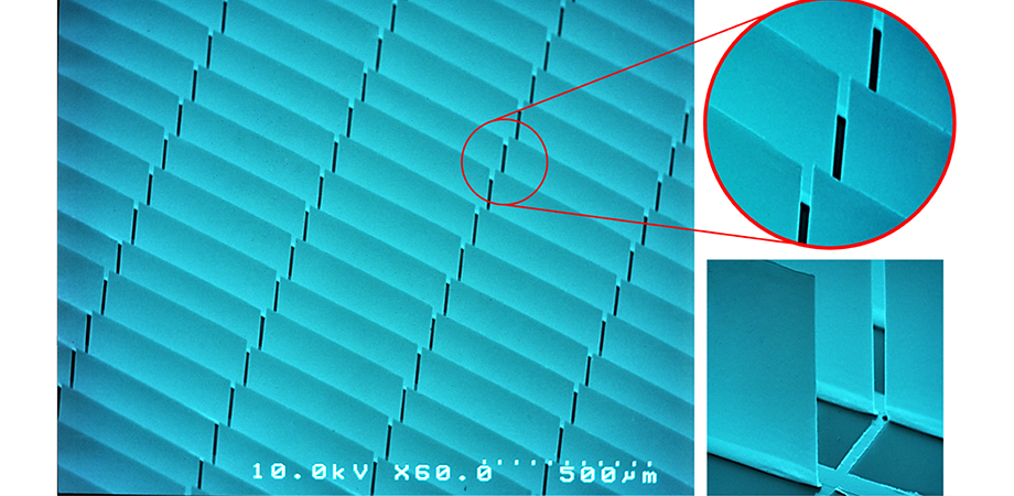 SEM micrograph of vertically standing, flat micromirror array with an inset of magnified area